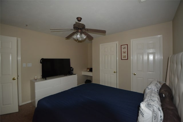 unfurnished bedroom with ceiling fan and carpet flooring