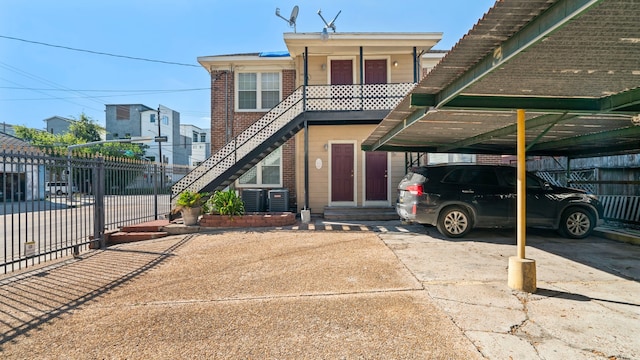 view of front of home featuring a carport