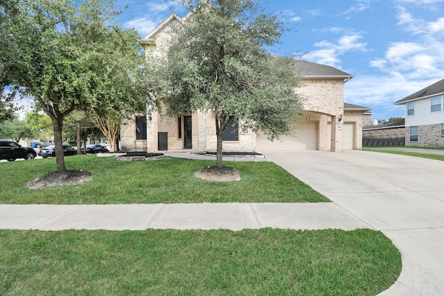 obstructed view of property with a front lawn and a garage