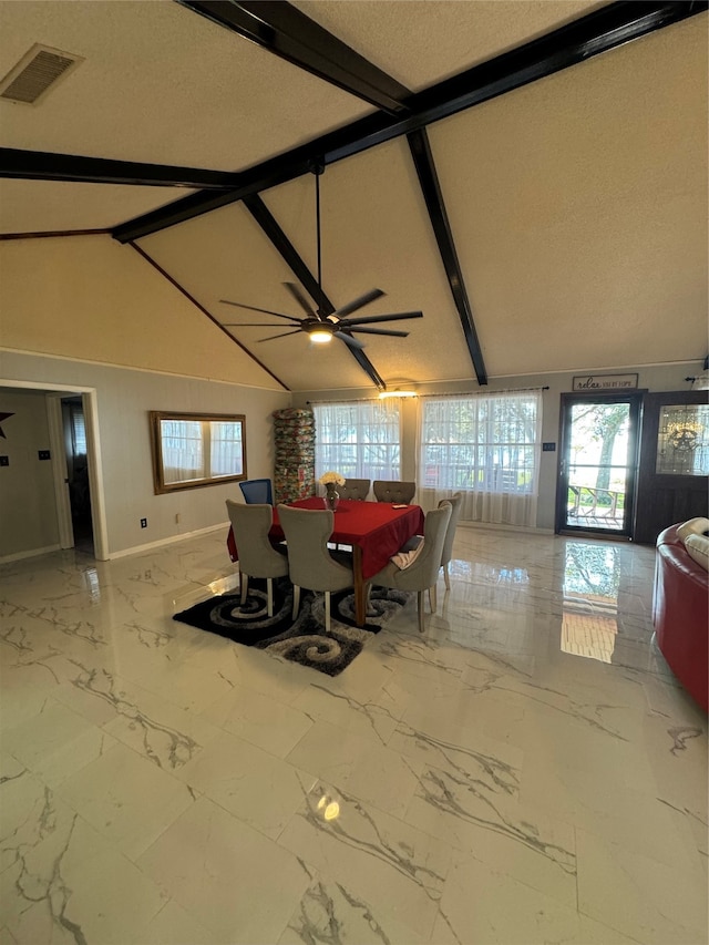 dining room with lofted ceiling with beams and ceiling fan