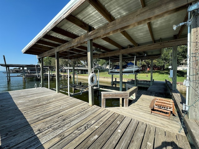 dock area with a water view