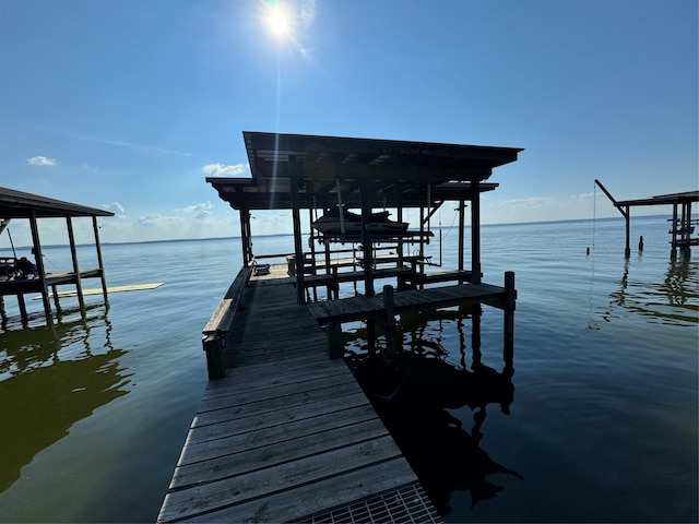 323 Mallard Pt, Livingston, TX 77351 - view of dock with a water view and boat lift