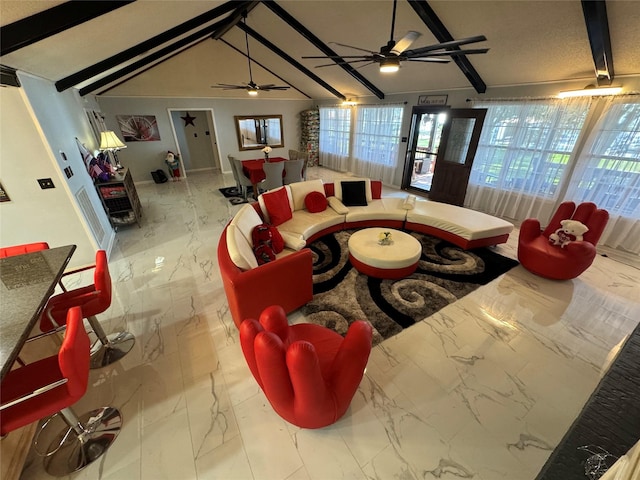 323 Mallard Pt, Livingston, TX 77351 - living area with marble finish floor, ceiling fan, and vaulted ceiling with beams
