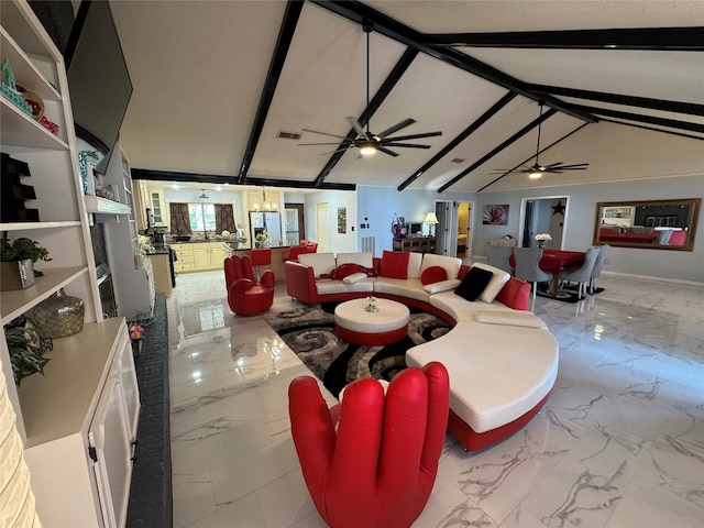 living room with ceiling fan with notable chandelier and lofted ceiling with beams