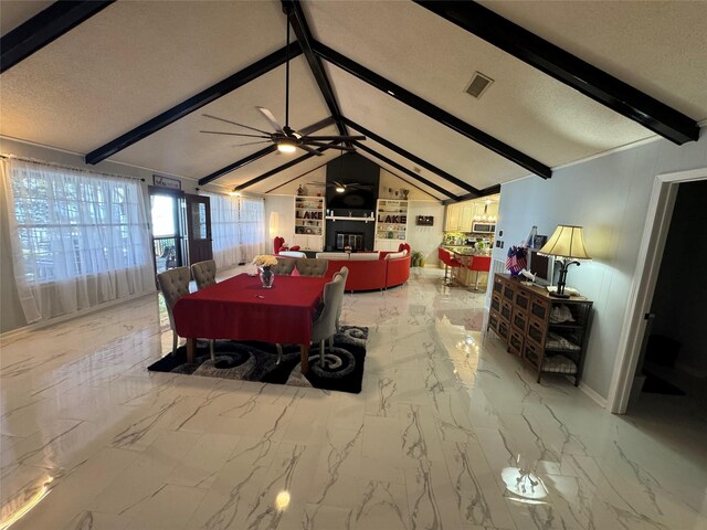 323 Mallard Pt, Livingston, TX 77351 - dining room with visible vents, a textured ceiling, vaulted ceiling with beams, and ceiling fan