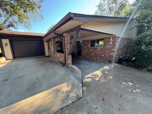 view of front of home featuring a carport and a garage