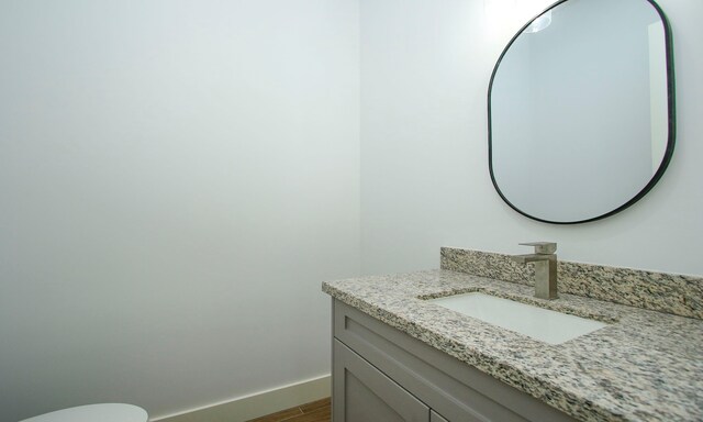 bathroom featuring vanity and hardwood / wood-style flooring