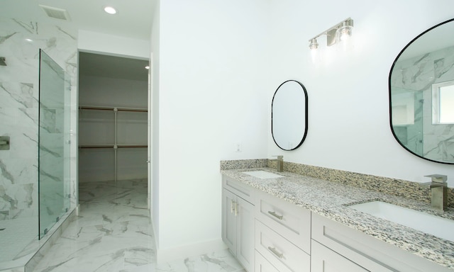 bathroom with vanity and an enclosed shower