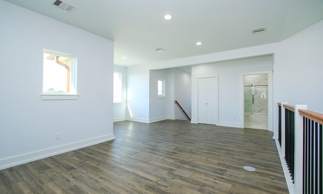 empty room featuring dark hardwood / wood-style flooring