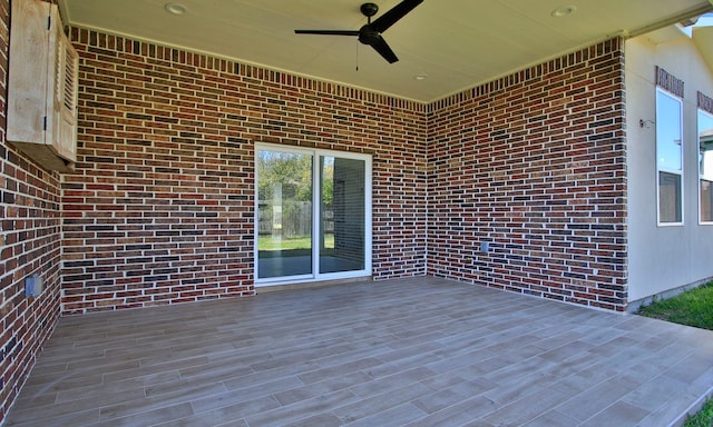 wooden deck with ceiling fan