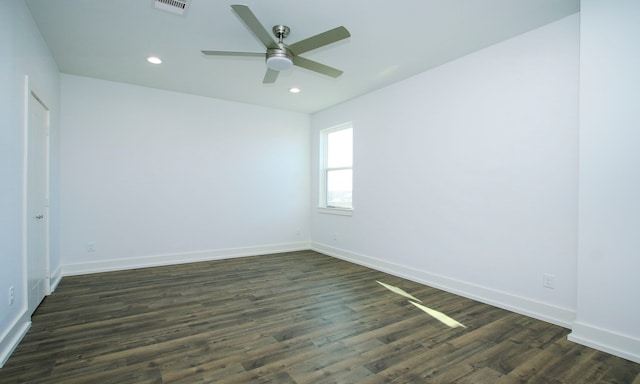 empty room featuring ceiling fan and dark hardwood / wood-style floors