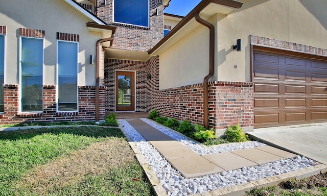 doorway to property with a garage