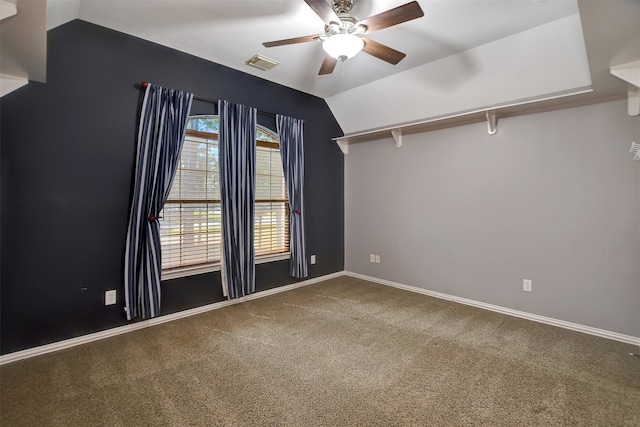 carpeted empty room featuring ceiling fan and lofted ceiling