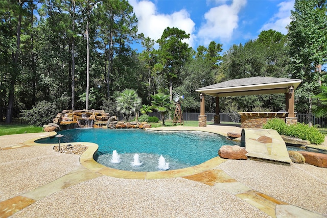 view of swimming pool with a gazebo, pool water feature, and a patio area