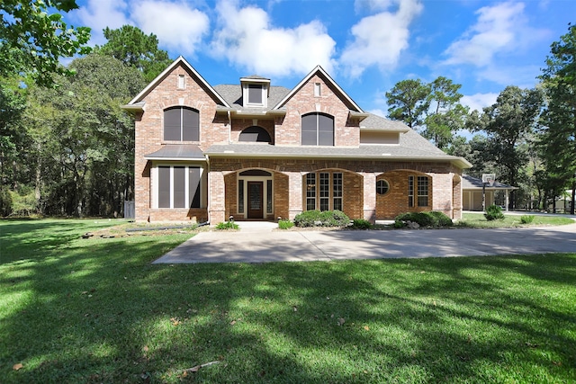 french provincial home featuring a front lawn