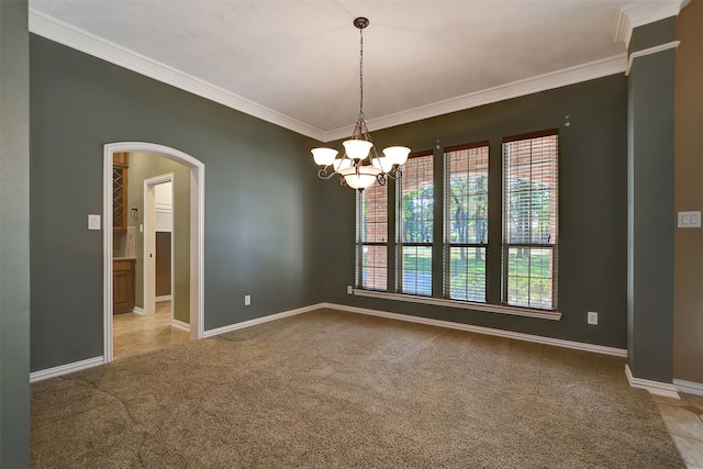 carpeted empty room featuring an inviting chandelier and crown molding