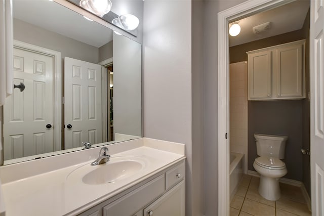 bathroom with tile patterned floors, vanity, and toilet