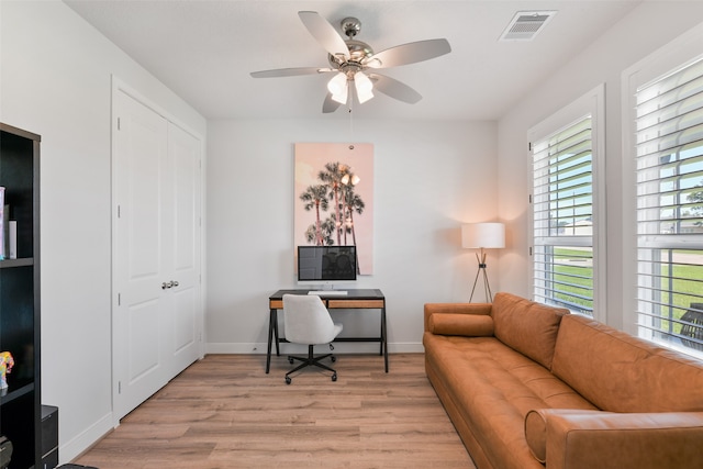 office space featuring light hardwood / wood-style flooring and ceiling fan