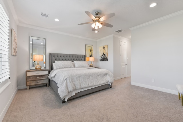 carpeted bedroom with multiple windows, ceiling fan, and crown molding