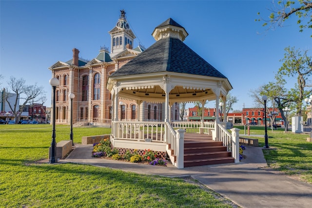 surrounding community featuring a gazebo and a lawn