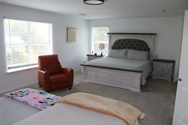 bedroom with light colored carpet