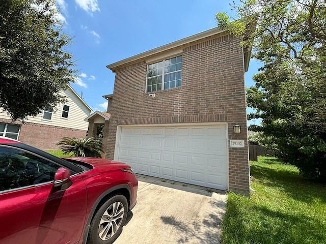 exterior space featuring a yard and a garage