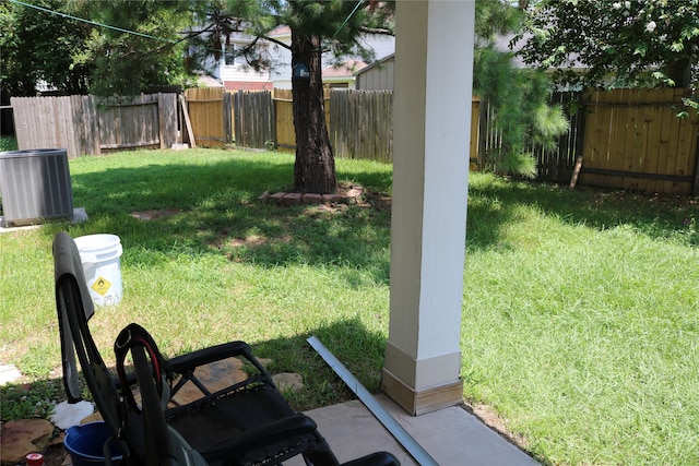 view of yard featuring central AC unit