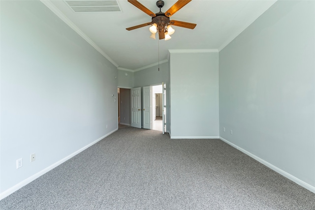 unfurnished bedroom featuring ornamental molding, carpet flooring, and ceiling fan