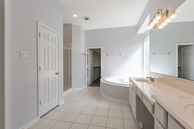 bathroom with vanity, shower with separate bathtub, and tile patterned flooring