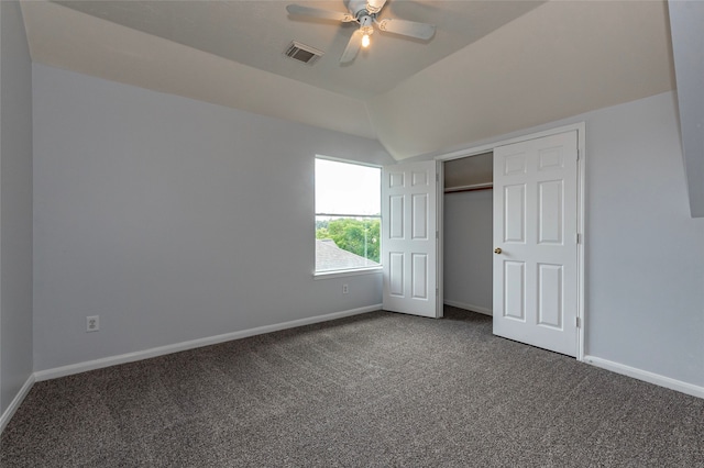 unfurnished bedroom featuring lofted ceiling, carpet floors, and ceiling fan