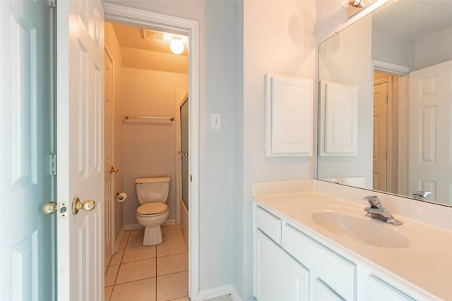 bathroom featuring vanity, toilet, and tile patterned floors