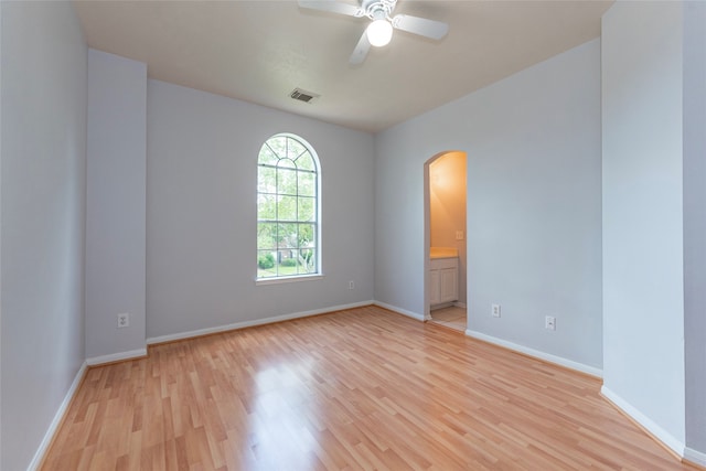 empty room with light wood-type flooring and ceiling fan