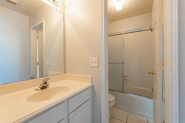 full bathroom with enclosed tub / shower combo, a textured ceiling, toilet, vanity, and tile patterned flooring