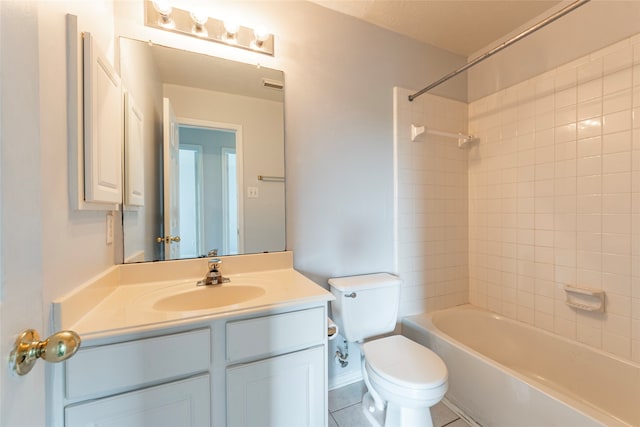 full bathroom featuring vanity, tiled shower / bath combo, toilet, and tile patterned floors