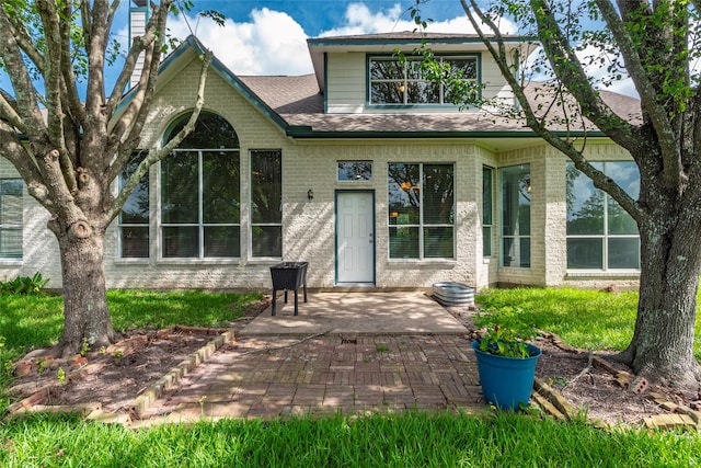 rear view of house with a patio area