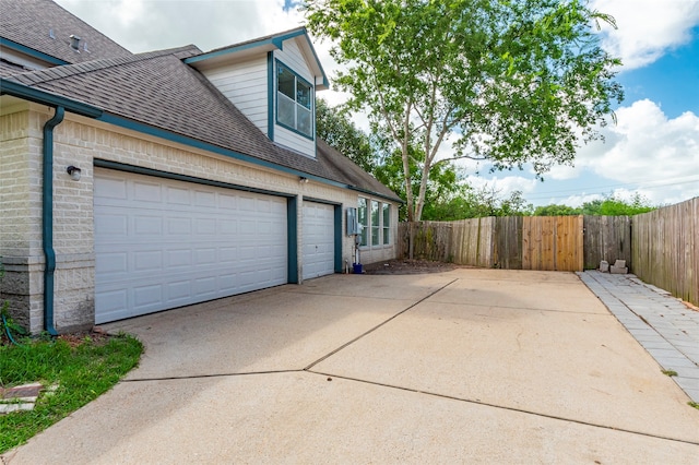 view of side of property featuring a garage