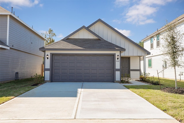 view of front of house with a garage and a front yard