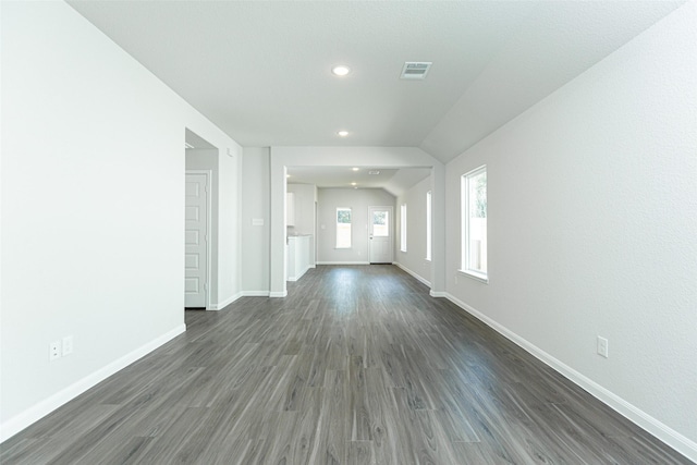 unfurnished living room featuring dark wood-type flooring