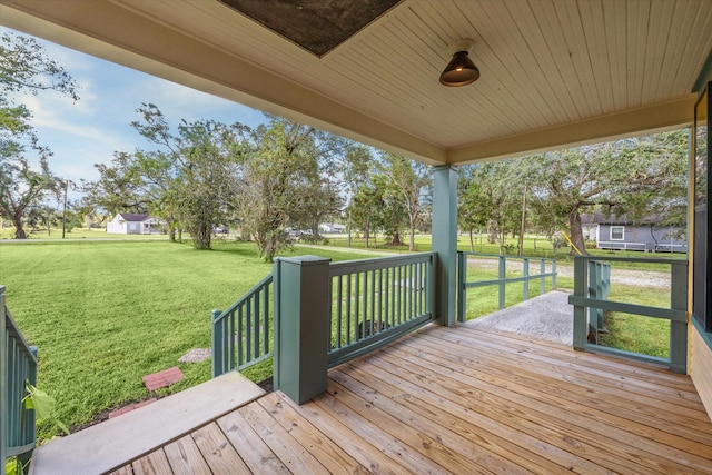 deck featuring a lawn