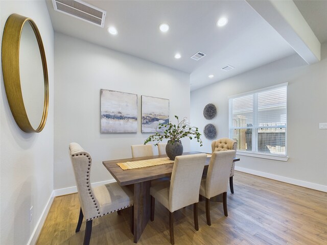 dining space with light wood-type flooring