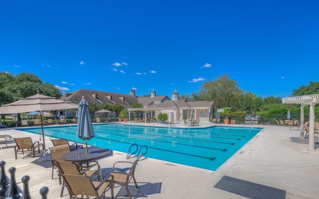 view of swimming pool with a patio area