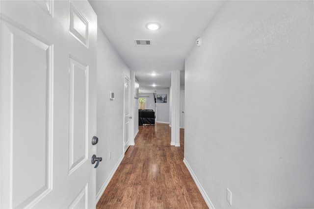 hall featuring dark wood-type flooring