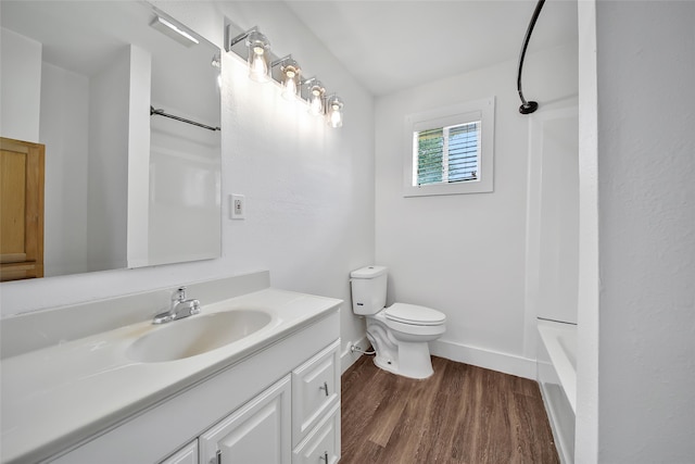 full bathroom with wood-type flooring, vanity, toilet, and shower / bathing tub combination