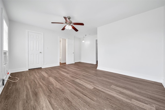 interior space featuring ceiling fan and dark wood-type flooring