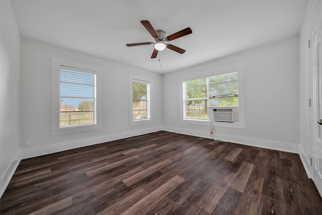 empty room featuring cooling unit, ceiling fan, and dark hardwood / wood-style flooring