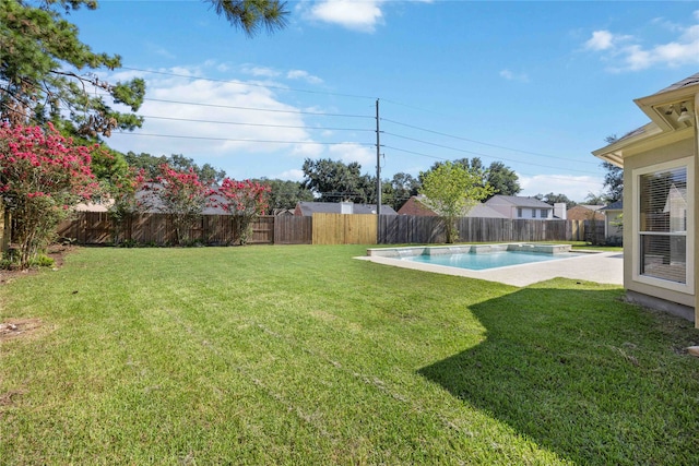 view of yard with a fenced in pool