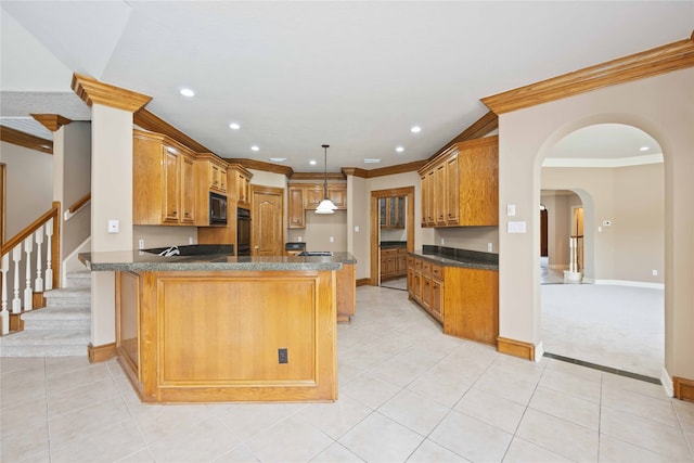 kitchen with black microwave, kitchen peninsula, crown molding, pendant lighting, and light carpet