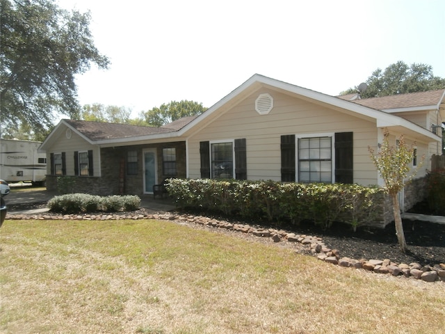 ranch-style house with a front lawn