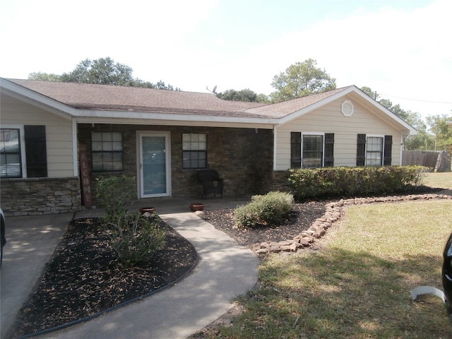 ranch-style home with a front yard