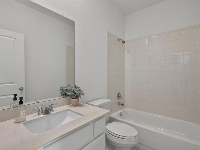 full bathroom with vanity, toilet, and tiled shower / bath combo